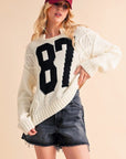 Aemi+Co Contrast Number Cable Knit Drop Shoulder Sweater