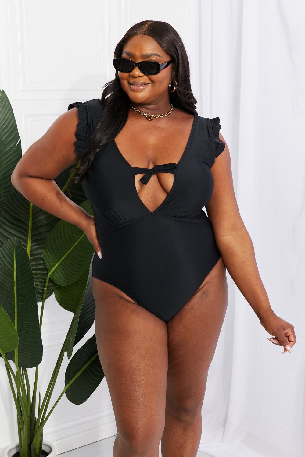 Lavender Marina West Swim Seashell Ruffle Sleeve One-Piece in Black Sentient Beauty Fashions Swimwear