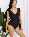 Black Marina West Swim Full Size Float On Ruffle Faux Wrap One-Piece in Black Sentient Beauty Fashions Swimwear
